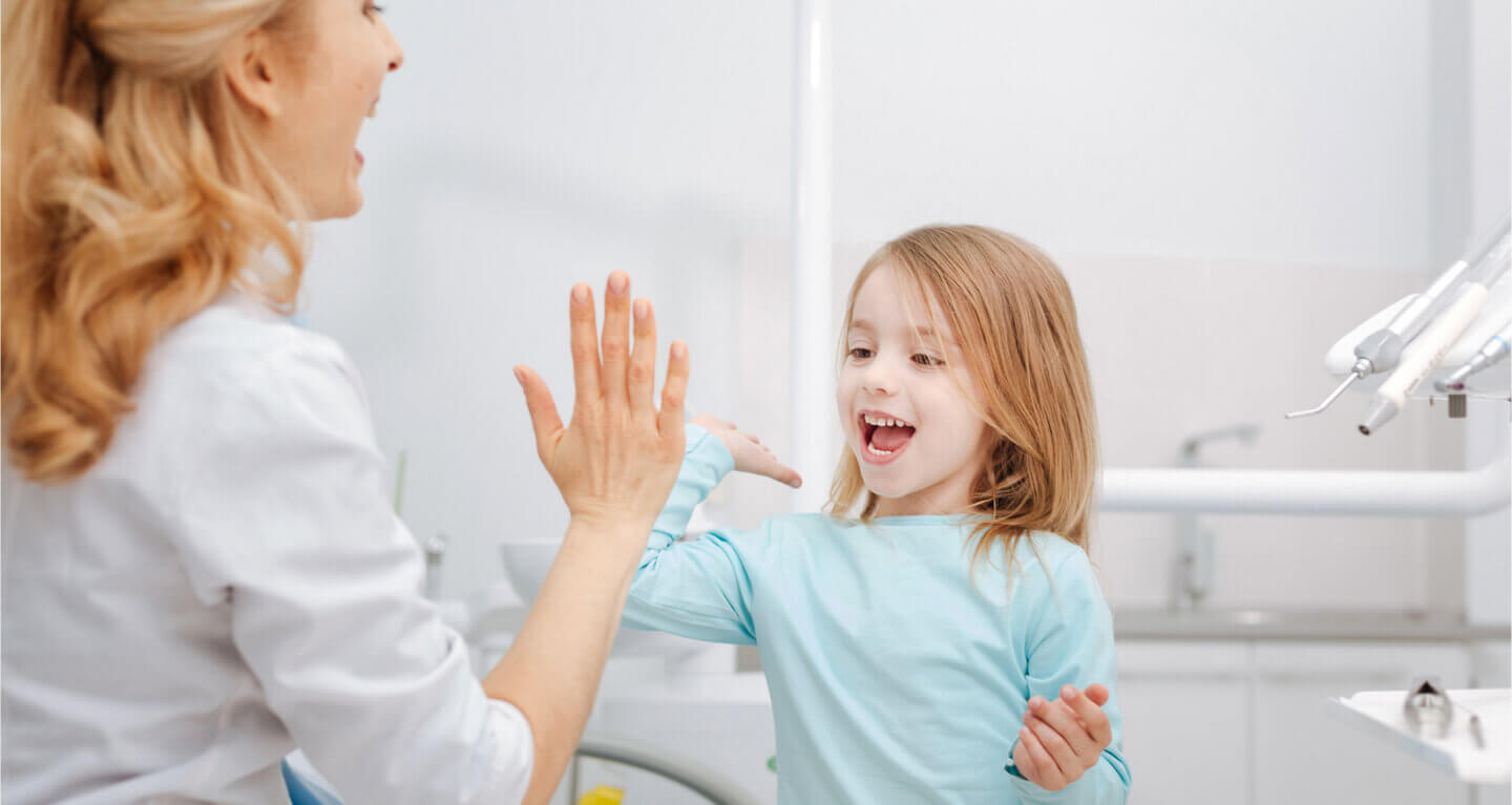 Doctor and happy patient child