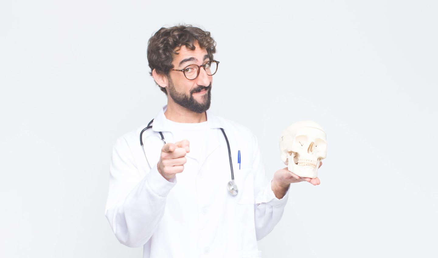 Doctor ironically holding a skull